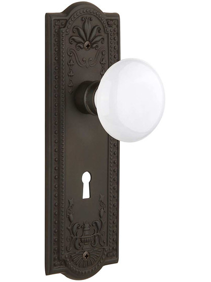 Meadows Door Set with White Porcelain Knobs and Keyhole - 2 3/8 in Oil-Rubbed Bronze.